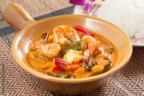 Panang Khung curry shrimp in a bowl with rice on the side