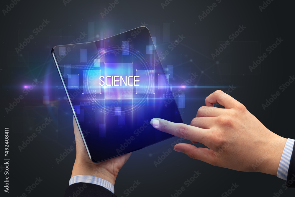 Businessman holding a foldable smartphone Businessman holding a foldable smartphone