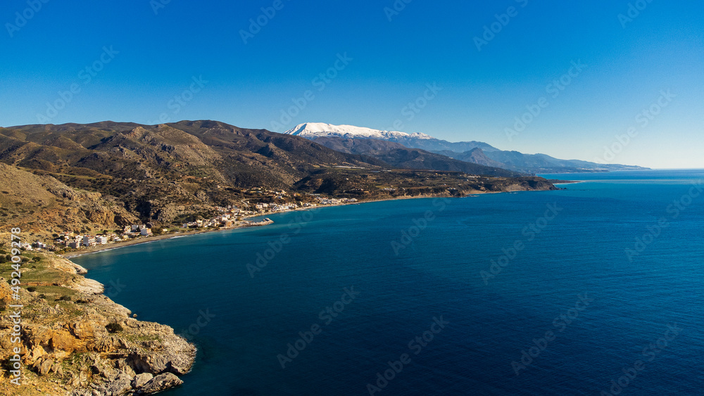 Scenic aerial shot of a beautiful landscape with mountains and the sea in Crete, Greece