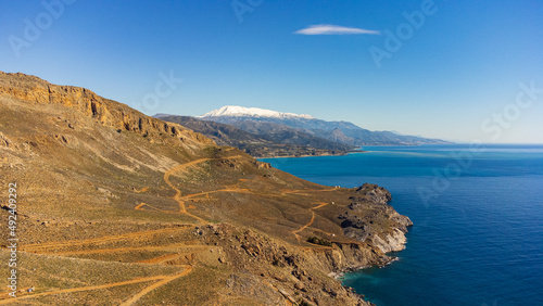 Scenic aerial shot of a beautiful landscape with mountains and the sea in Crete, Greece