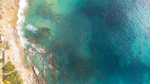 scenic drone shot of a beautiful beach in Crete, Greece