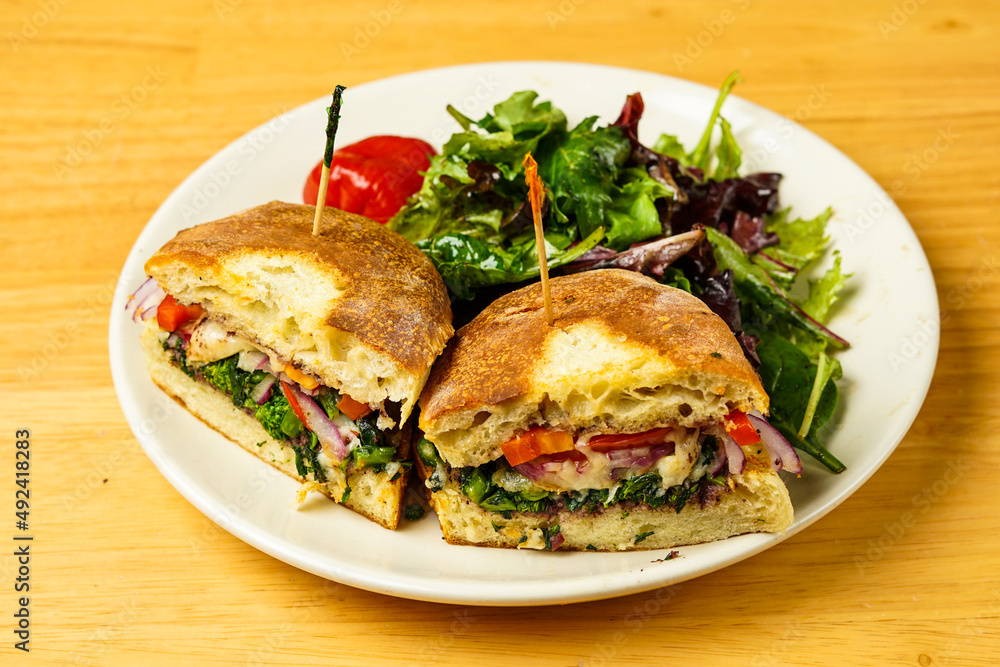 Sandwich with broccoli rabe and sweet red peppers