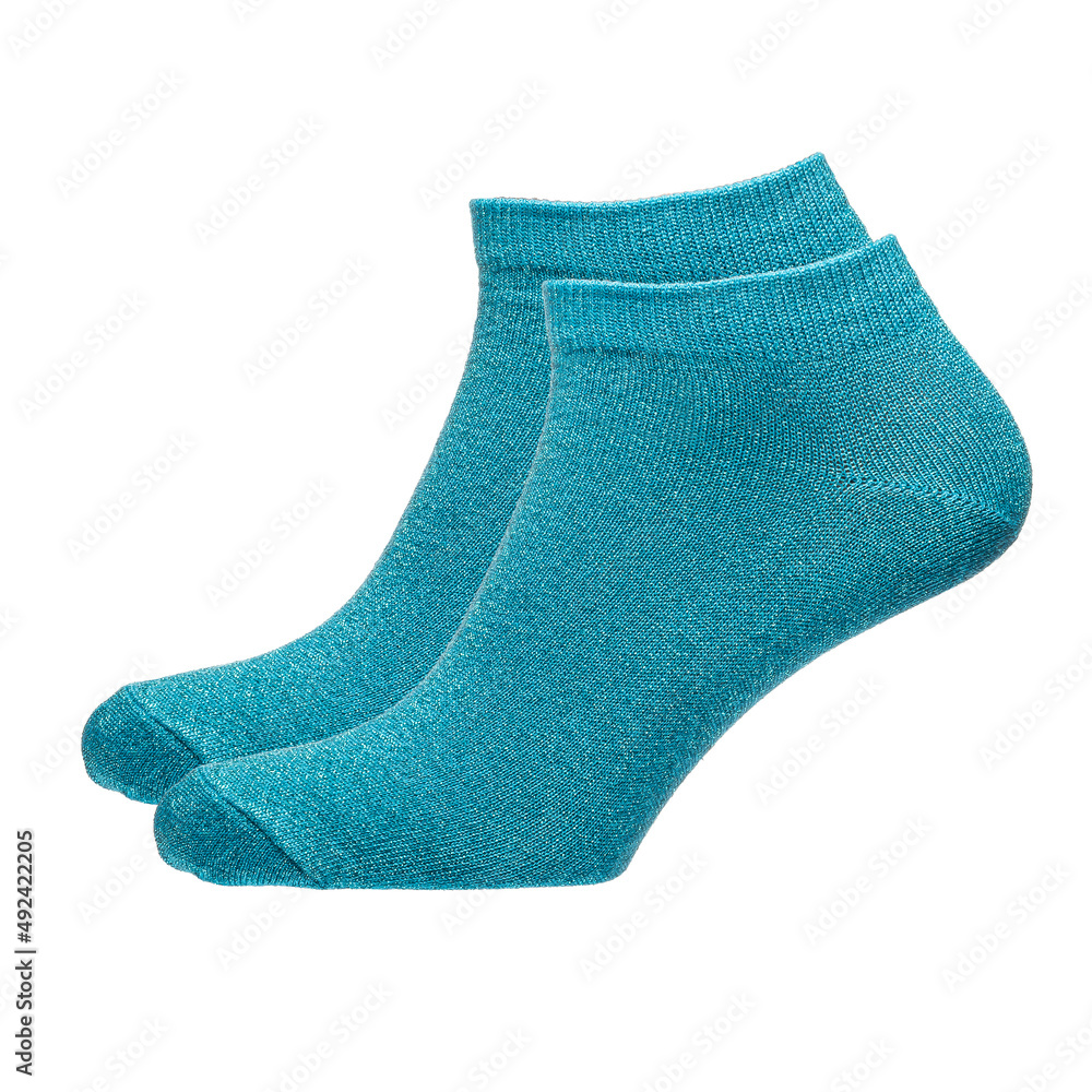 A pair of fabric socks stands on a white isolated background. Volumetric socks on a transparent mannequin. Blue socks. A pair of fabric socks stands on a white isolated background. Volumetric socks on a transparent mannequin. Blue socks.