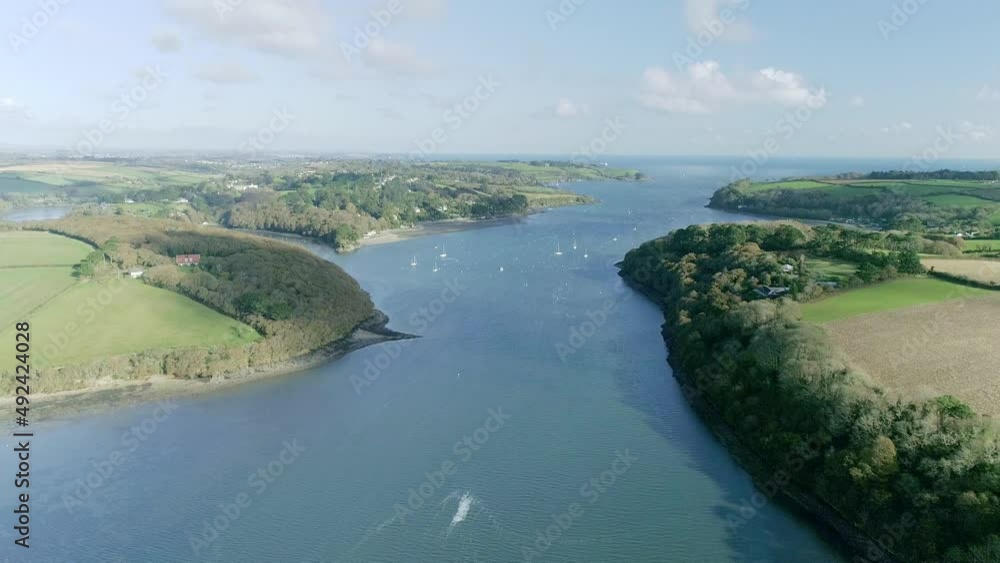Stunning sunny river aerial shot on the southern coast of England. Looking out to sea Stunning sunny river aerial shot on the southern coast of England. Looking out to sea