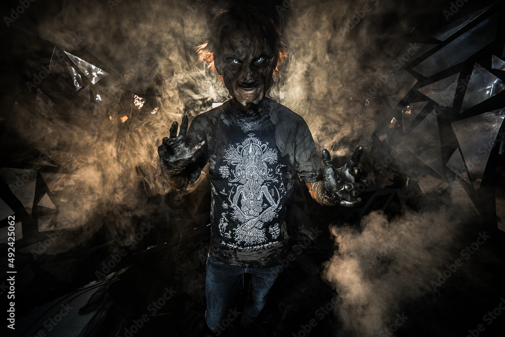 Fototapeta premium scary sorcerer in smoke. voodoo rite