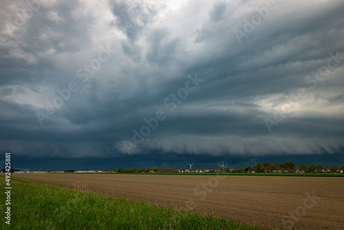 Roll cloud or arcus belonging to a severe thunderstorm over the fields of Holland photo