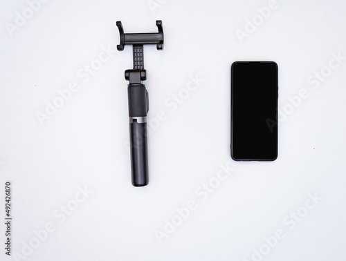 black phone and black phone tripod on white isolated background mockup blog learning online