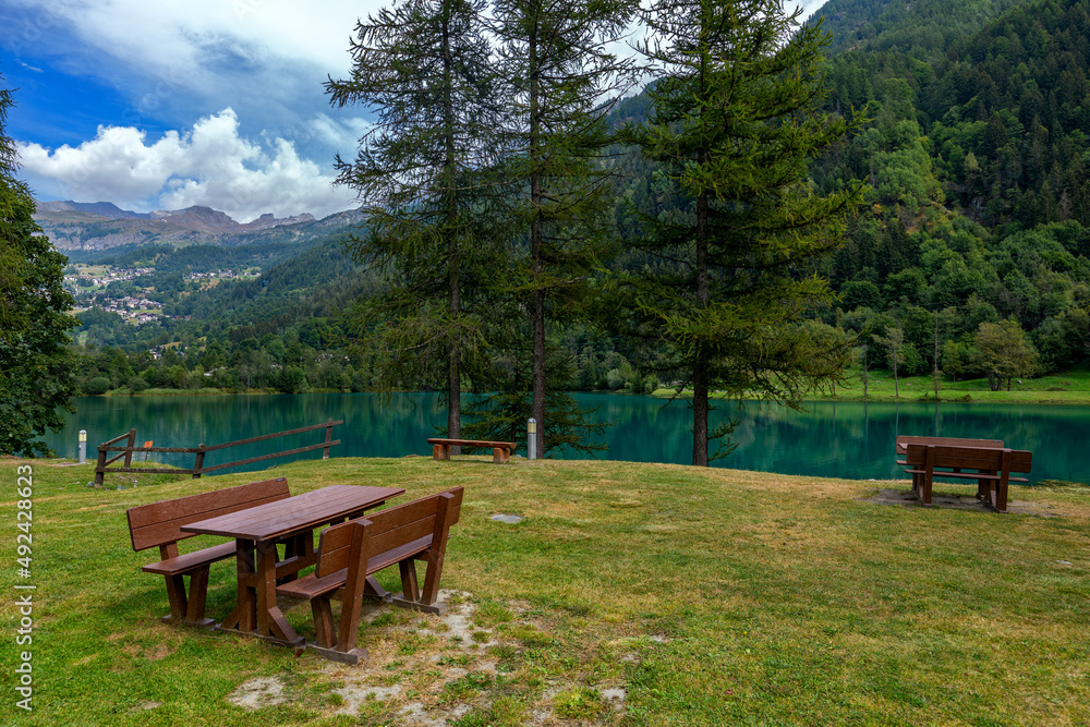 Picnic tables on the lakeside in Aosta Valley, Italy. Picnic tables on the lakeside in Aosta Valley, Italy.