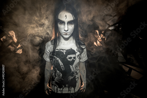 the sorceress stands in the smoke. voodoo rite