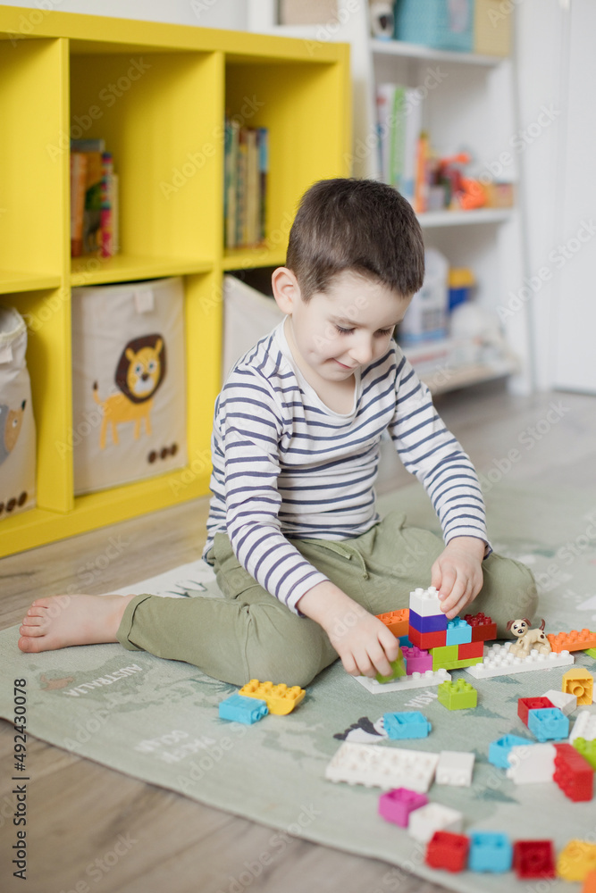 Child playing with colorful toy blocks Child playing with colorful toy blocks