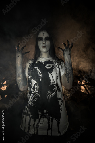 Fototapeta Naklejka Na Ścianę i Meble -  the sorceress stands in the smoke. voodoo rite