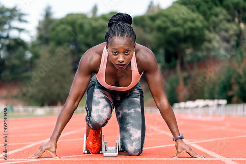 Plakat Athlete sprinter in starting position
