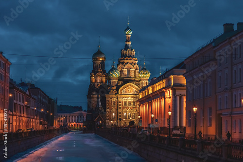 Church of the Savior on Spilled Blood (also known as Tserkovʹ Spasa na Krovi) at night in Saint Petersburg city, Russia. Griboedov Canal covered with ice. Travel in winter Russia theme.
