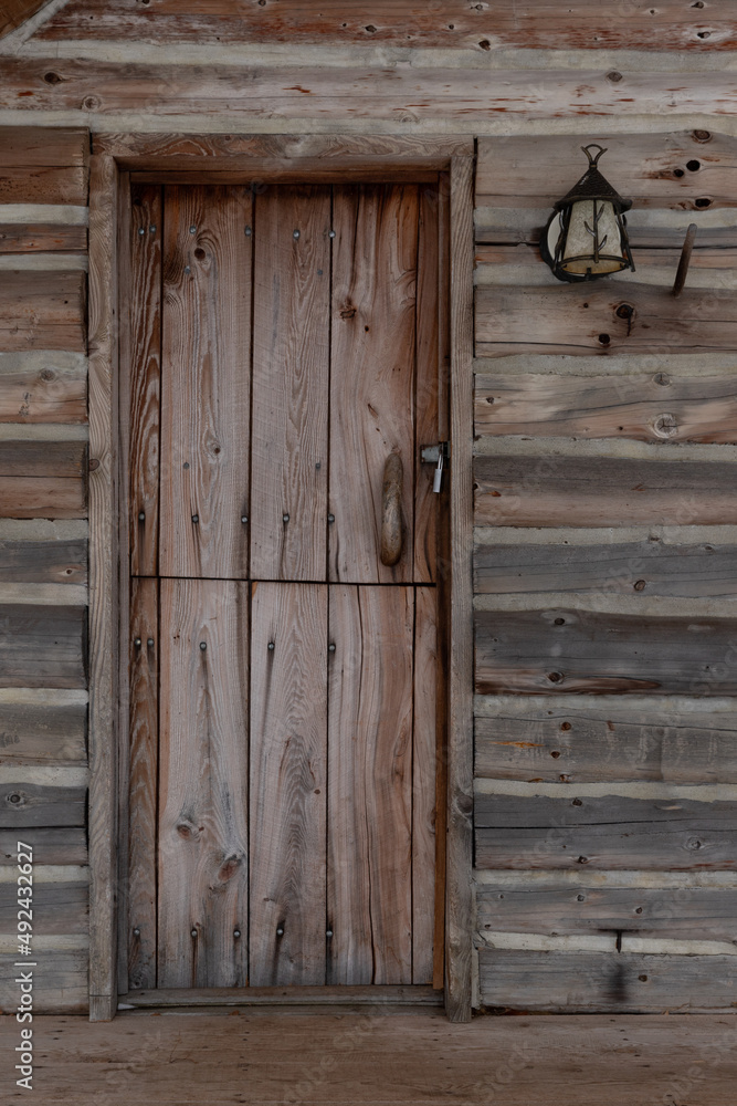 Rustic cabin door and porch light