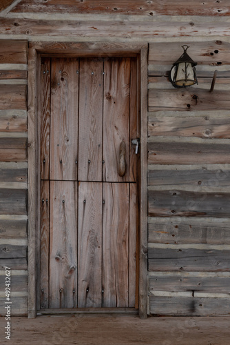 Rustic cabin door and porch light