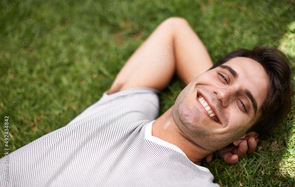 Nature is so relaxing. High angle portrait of a young man relaxing outdoors. Nature is so relaxing. High angle portrait of a young man relaxing outdoors.