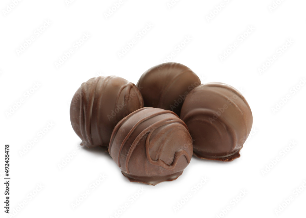 Delicious sweet chocolate truffles on white background Delicious sweet chocolate truffles on white background