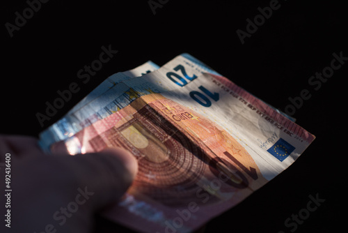 The concept of cash payment. Paper money in hand.