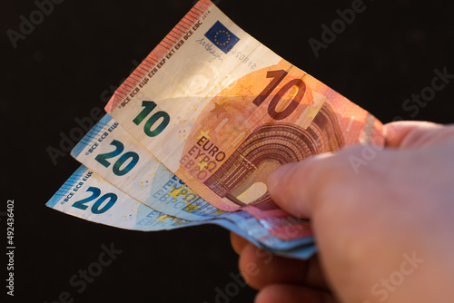 The concept of cash payment. Paper money in hand.