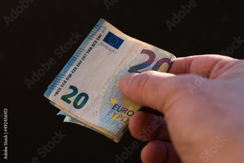 The concept of cash payment. Paper money in hand.