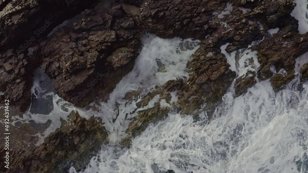 Sea Waves Hit Rocky Shore. Foam From Waves. Top View. Sea Waves Hit Rocky Shore. Foam From Waves. Top View.
