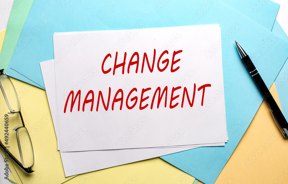 CHANGE MANAGEMENT text on paper on the colorful paper background CHANGE MANAGEMENT text on paper on the colorful paper background