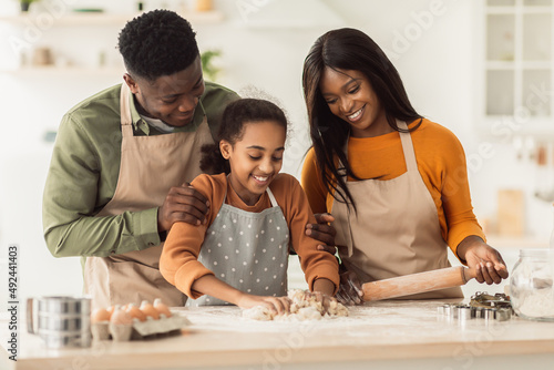 Black Family Kneading Dough Baking Together Making Cookies In Kitchen