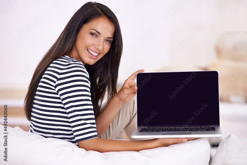 This laptop has improved functionality. Portrait of an attractive young woman holding open her laptop. This laptop has improved functionality. Portrait of an attractive young woman holding open her laptop.
