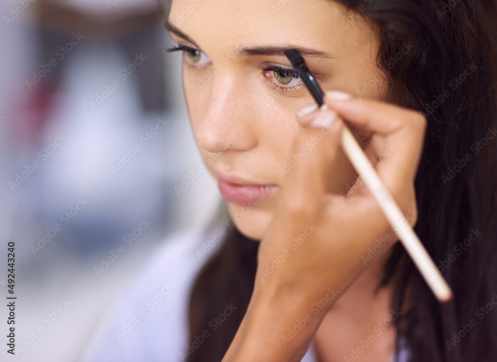 Brining out the best for that special occasion. A young woman having makeup applied. Brining out the best for that special occasion. A young woman having makeup applied.