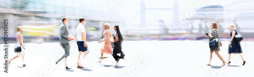 People walking in the City, blurred wide background representing modern fast moving life in the capital City. People crossing the road. 
