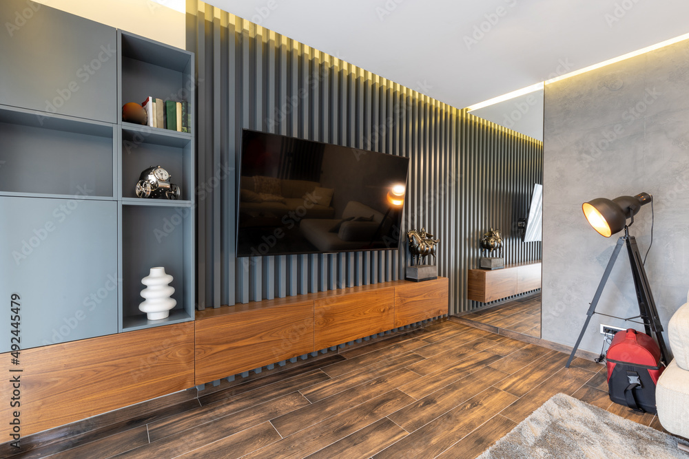 Luxury living room interior with wood slat wall - obrazy, fototapety, plakaty 