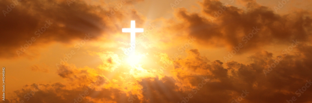The cross of christ in the sunrise sky,