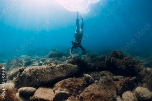 Girl underwater in ocean. Lady snorkeling in ocean