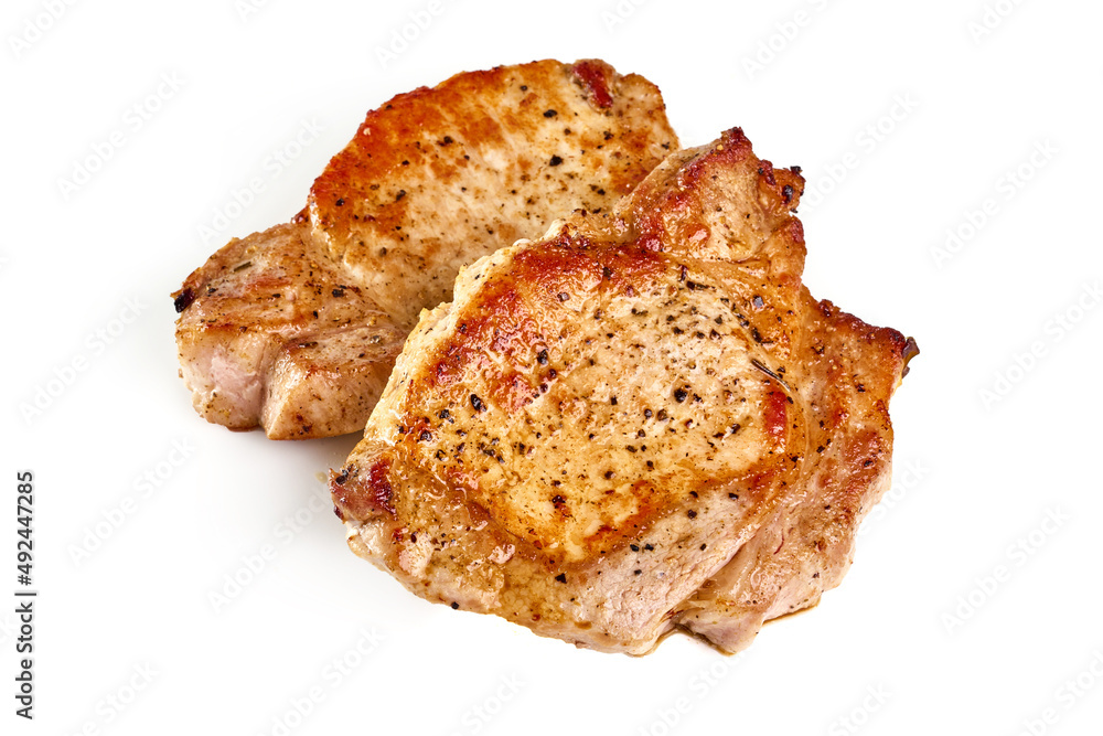 Grilled juicy pork steak, close-up, isolated on white background. Grilled juicy pork steak, close-up, isolated on white background.