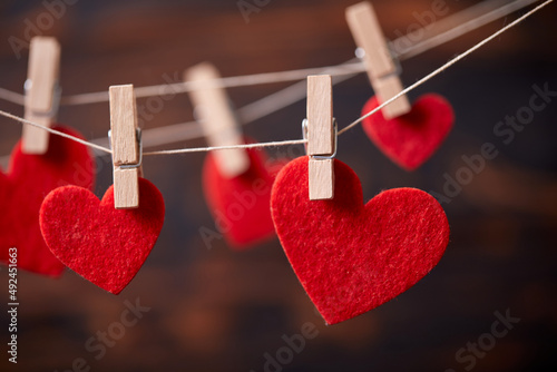 Photos Red heart on wooden clothespin