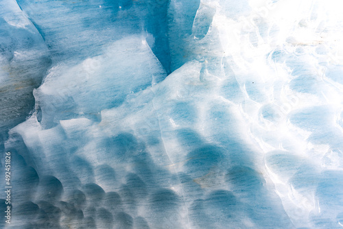 Fototapeta Naklejka Na Ścianę i Meble -  Breaking ice in glacier, ice wall texture taken from a natural glacier cave in Zinal, Switzerland 