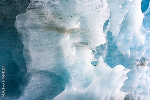 Fototapeta Breaking ice in glacier, ice wall texture taken from a natural glacier cave in Z