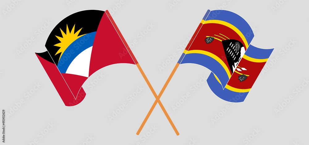 Crossed and waving flags of Antigua and Barbuda and Eswatini