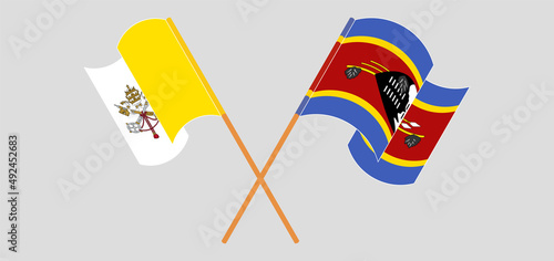Crossed and waving flags of Vatican and Eswatini