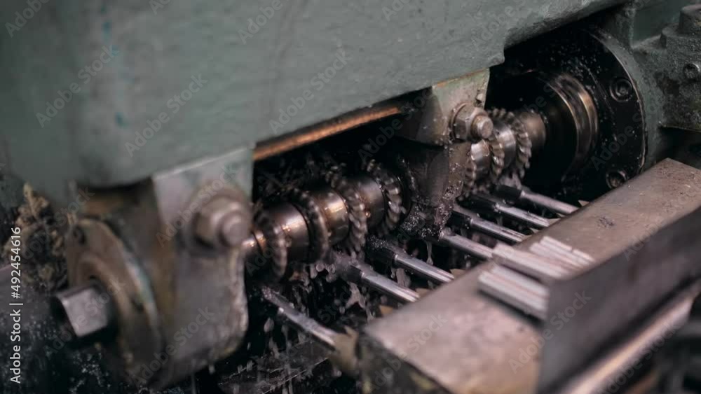 An industrial lathe processes metal. Tool manufacturing. Production of drills. An industrial lathe processes metal. Tool manufacturing. Production of drills.