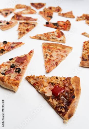 Pizza slices closeup isolated on white
