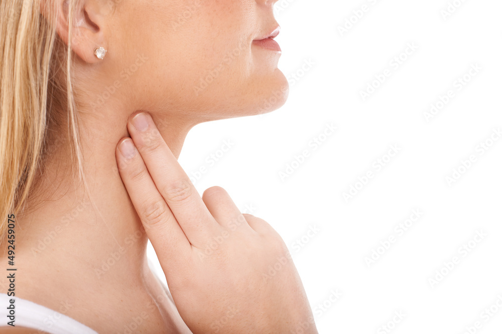 Monitoring her pulse rate carefully. Young woman taking her pulse rate against a white background. Monitoring her pulse rate carefully. Young woman taking her pulse rate against a white background.