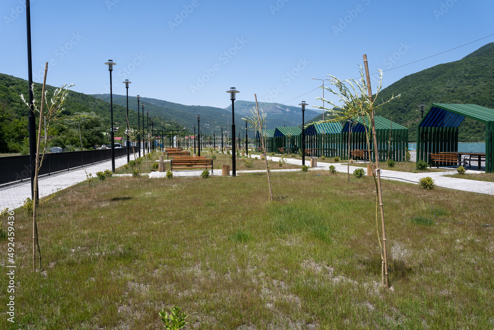 recreation area by the lake in the mountains where there is a yard, some cottages and children's slides, benches and other beach recreation recreation area by the lake in the mountains where there is a yard, some cottages and children's slides, benches and other beach recreation