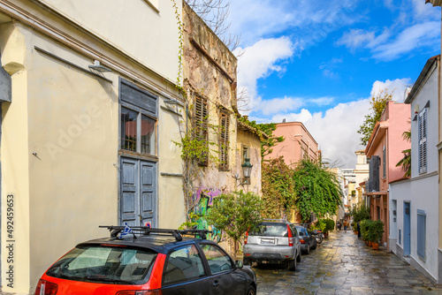 Fototapeta Naklejka Na Ścianę i Meble -  Morning after a rainstorm on a colorful, wet, street in the Plaka district of Athens, Greece.
