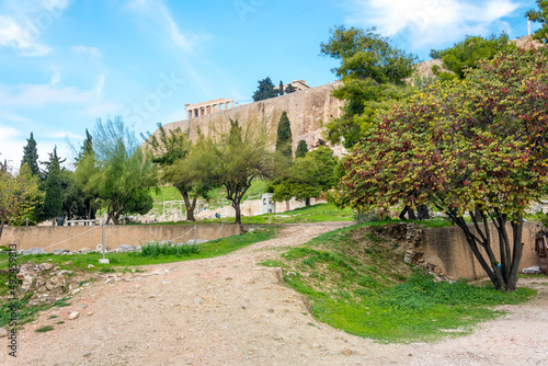 The south slop of Acropolis Hill, with the Parthenon and the ancient ruins of the theater in view in the historic center of Athens, Greece.