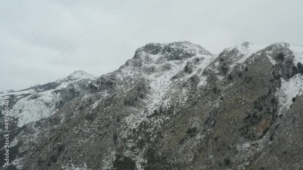 Drone shooting of Rocche del Crasto in winter, a mountainous and rocky complex where the golden eagle nests, Nebrodi, Sicily, Italy. Typical villages set between the fortresses. Longi and Alcara. Drone shooting of Rocche del Crasto in winter, a mountainous and rocky complex where the golden eagle nests, Nebrodi, Sicily, Italy. Typical villages set between the fortresses. Longi and Alcara.