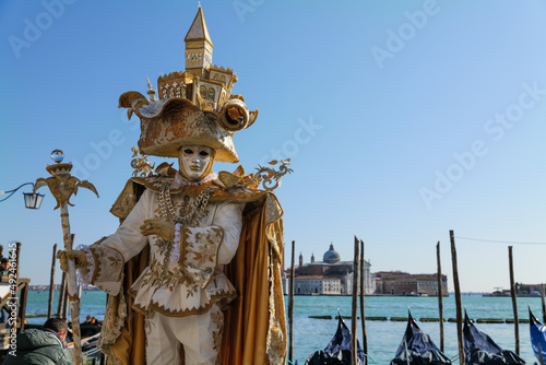 Venice  Italy - February 2022 - carnival masks are photographed with tourists in San Marco square