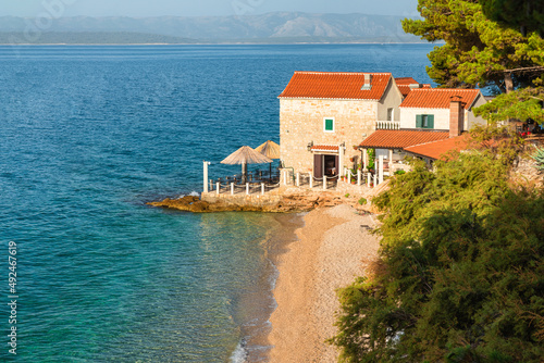Small coastal restaurant on the beach on Adriatic sea in Bol town, Brac island, Croatia