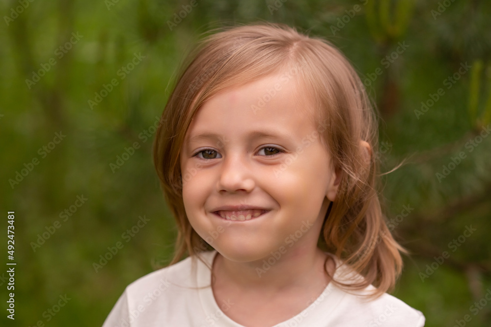 Portrait of cute little caucasian girl in casual closing in the forest Portrait of cute little caucasian girl in casual closing in the forest