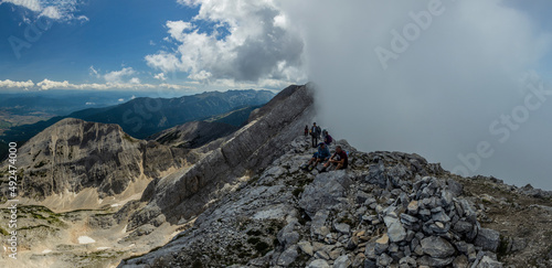 PIRIN, BULGARIA - AUGUST 4, 2019: Hikers at Koncheto ridge in Pirin mountains, Bulgaria photo